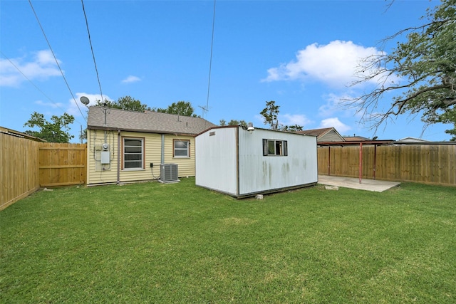 1705 13th St, Galena Park, TX 77547 - back of house featuring a fenced backyard, a patio, and a storage shed