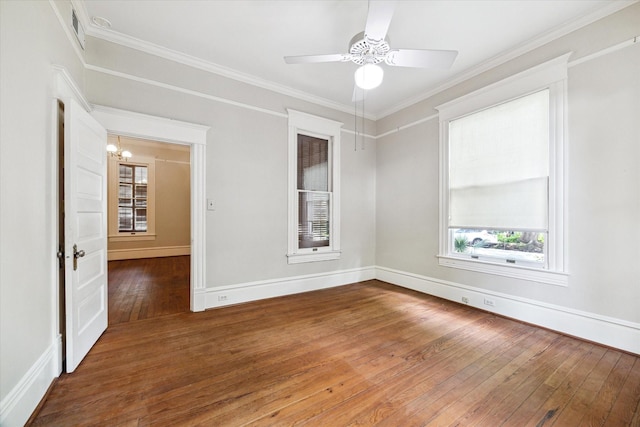 519 Bayland Ave, Houston, TX 77009 - empty room with hardwood / wood-style flooring, ornamental molding, a chandelier, and ceiling fan