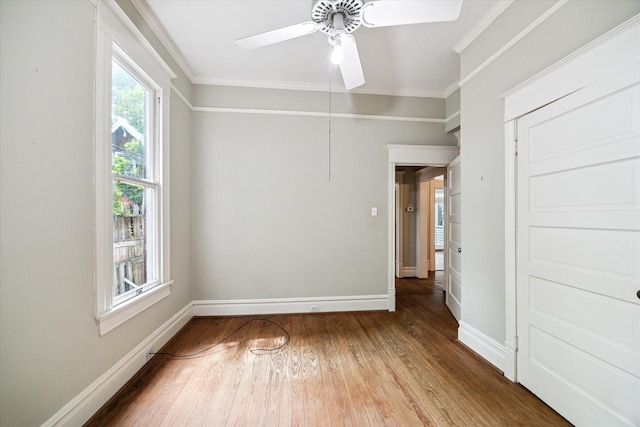 519 Bayland Ave, Houston, TX 77009 - unfurnished room with hardwood / wood-style flooring, crown molding, and a ceiling fan