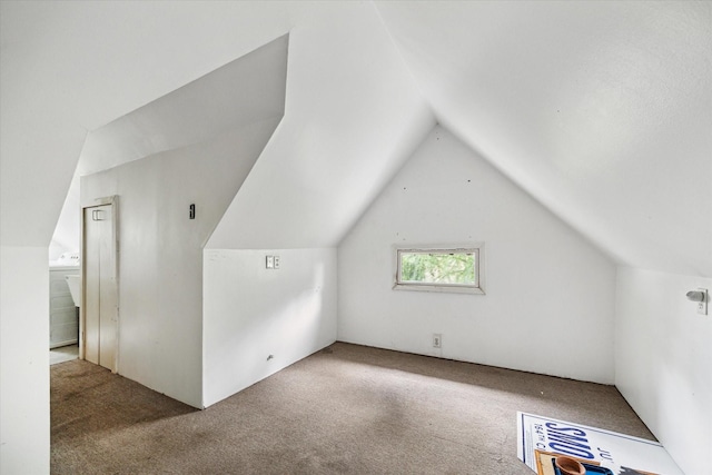 519 Bayland Ave, Houston, TX 77009 - additional living space featuring carpet flooring and vaulted ceiling