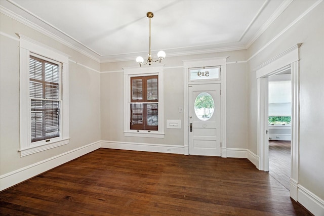 519 Bayland Ave, Houston, TX 77009 - entrance foyer with a chandelier, dark wood-style flooring, and crown molding
