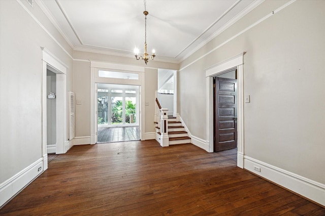 519 Bayland Ave, Houston, TX 77009 - spare room featuring stairs, a chandelier, dark wood-style floors, and ornamental molding