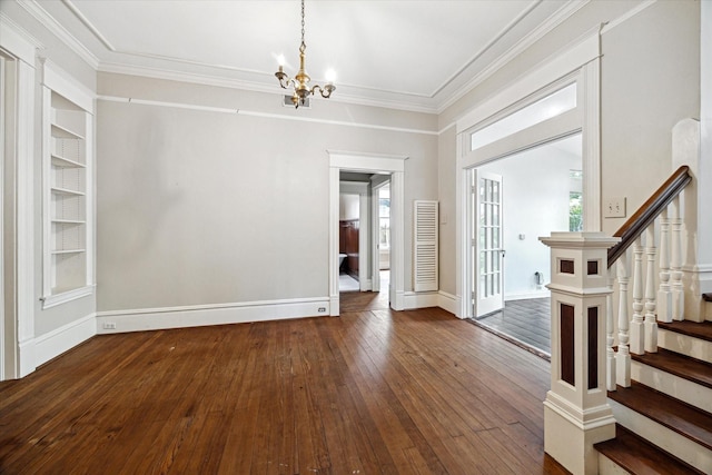 519 Bayland Ave, Houston, TX 77009 - entrance foyer featuring a chandelier, dark wood finished floors, crown molding, and stairs