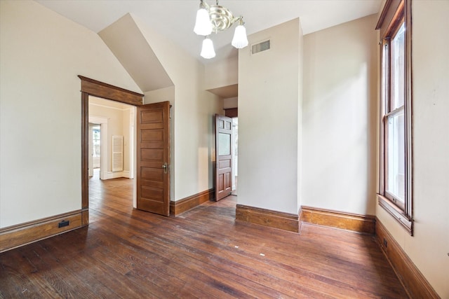 519 Bayland Ave, Houston, TX 77009 - unfurnished room featuring a chandelier and hardwood / wood-style floors