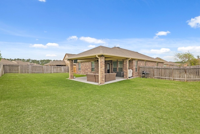 18015 Van Berkel Ln, Houston, TX 77044 - back of property with a patio area, a fenced backyard, brick siding, and outdoor lounge area
