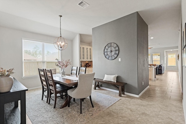 18015 Van Berkel Ln, Houston, TX 77044 - dining area with a chandelier and baseboards