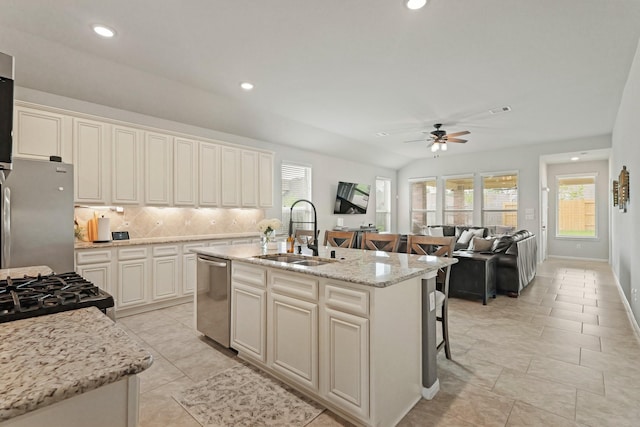 18015 Van Berkel Ln, Houston, TX 77044 - kitchen with appliances with stainless steel finishes, ceiling fan, healthy amount of natural light, decorative backsplash, and recessed lighting
