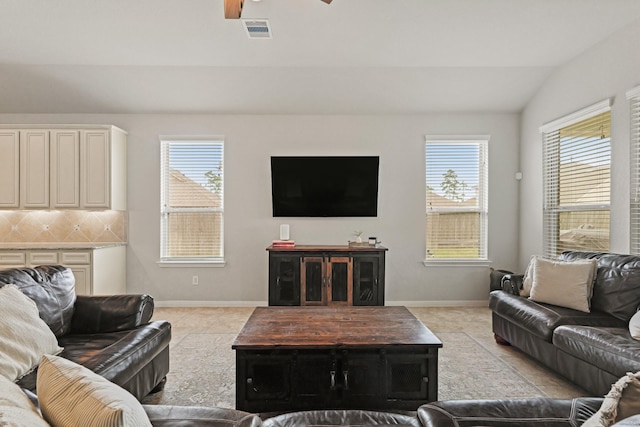 18015 Van Berkel Ln, Houston, TX 77044 - living area with vaulted ceiling, ceiling fan, and light tile patterned floors