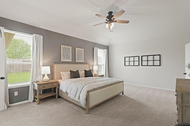 18015 Van Berkel Ln, Houston, TX 77044 - bedroom with light carpet, multiple windows, and a ceiling fan