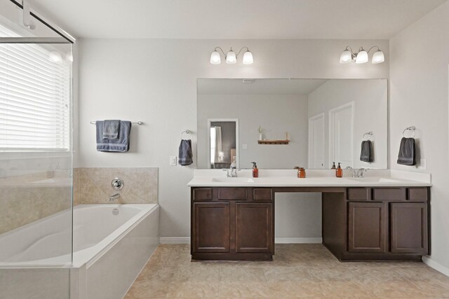 18015 Van Berkel Ln, Houston, TX 77044 - full bath with double vanity and a garden tub