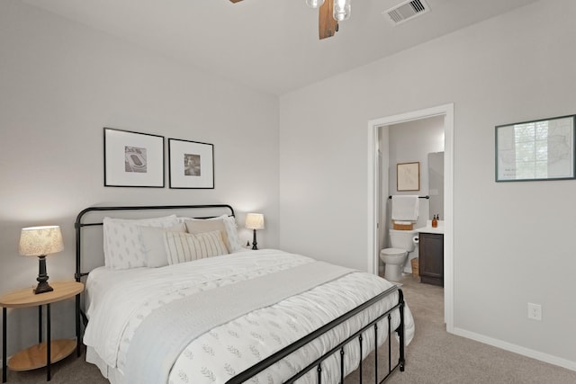 18015 Van Berkel Ln, Houston, TX 77044 - bedroom featuring light colored carpet, ensuite bathroom, and a ceiling fan