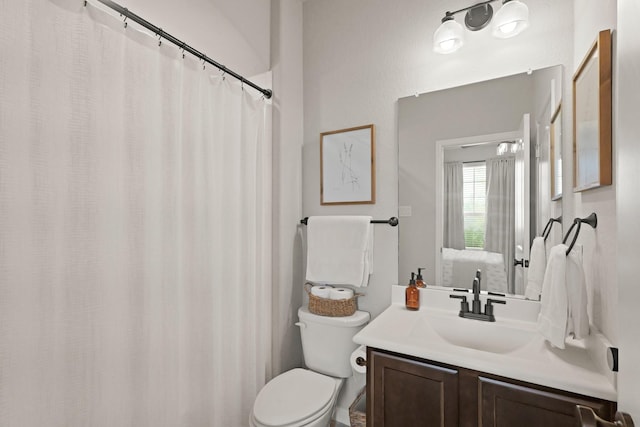 18015 Van Berkel Ln, Houston, TX 77044 - bathroom with vanity and a shower with shower curtain