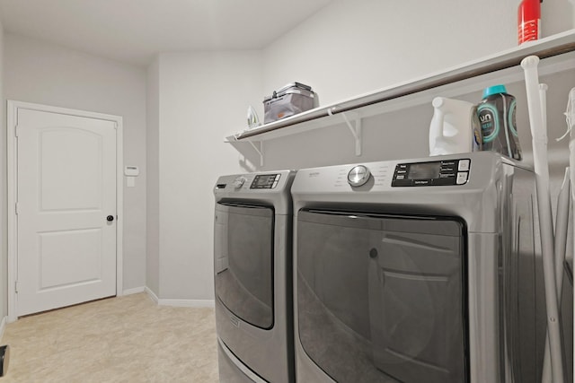 18015 Van Berkel Ln, Houston, TX 77044 - washroom featuring separate washer and dryer and baseboards