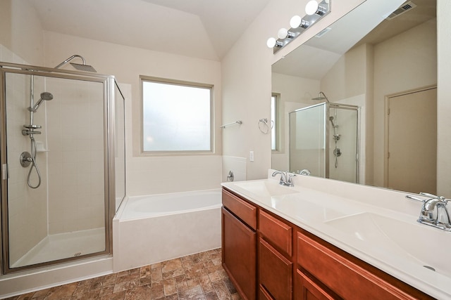 20603 Flintoff Ln, Katy, TX 77449 - bathroom with a shower stall, a bath, double vanity, and stone finish flooring