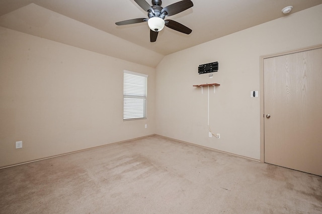 20603 Flintoff Ln, Katy, TX 77449 - spare room featuring light carpet, ceiling fan, vaulted ceiling, and a smoke detector