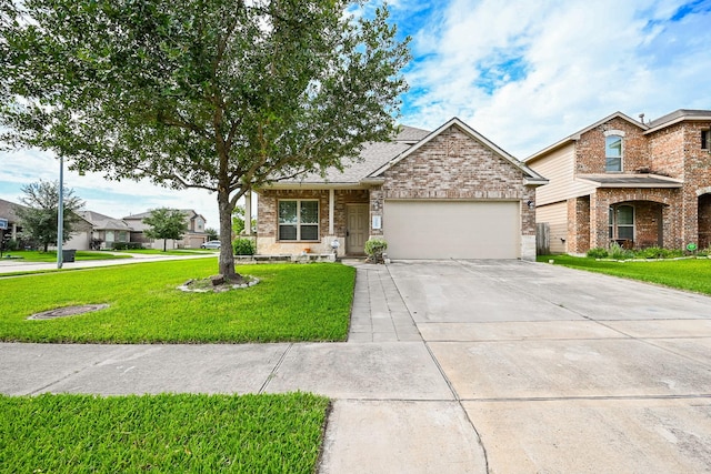 20603 Flintoff Ln, Katy, TX 77449 - view of front of house featuring a garage, driveway, a front lawn, brick siding, and a shingled roof