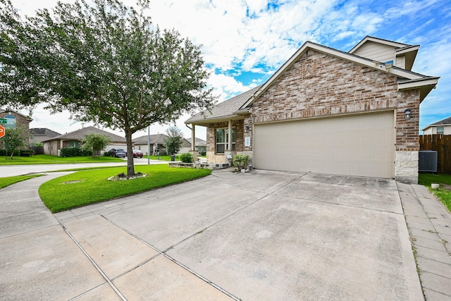 20603 Flintoff Ln, Katy, TX 77449 - view of front of house with concrete driveway, an attached garage, brick siding, and a residential view