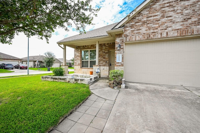 20603 Flintoff Ln, Katy, TX 77449 - view of front of property with a front lawn, concrete driveway, brick siding, and a garage