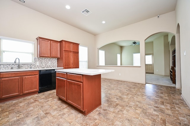 20603 Flintoff Ln, Katy, TX 77449 - kitchen featuring dishwasher, ceiling fan, light countertops, light stone finish floors, and recessed lighting