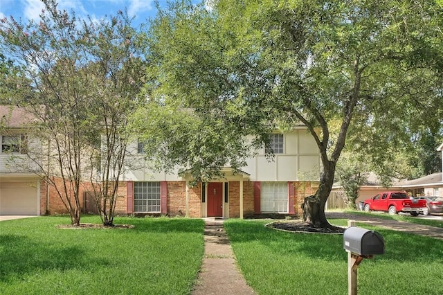 5703 Green Timbers Dr, Humble, TX 77346 - view of front facade with a front yard and brick siding