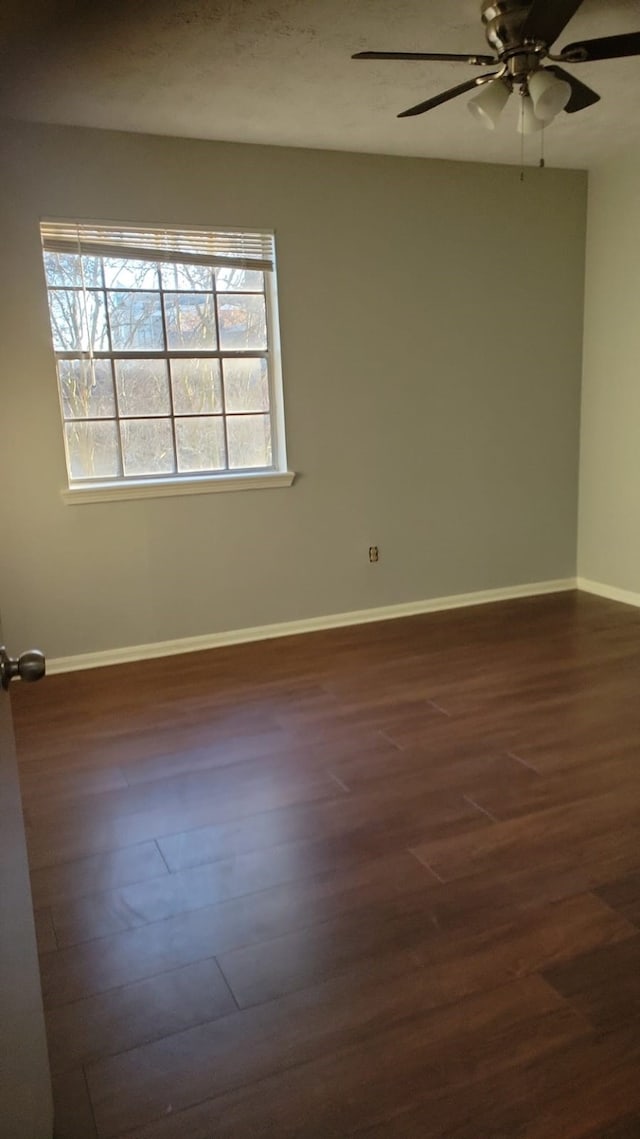 5703 Green Timbers Dr, Humble, TX 77346 - unfurnished room with dark wood-style flooring and ceiling fan