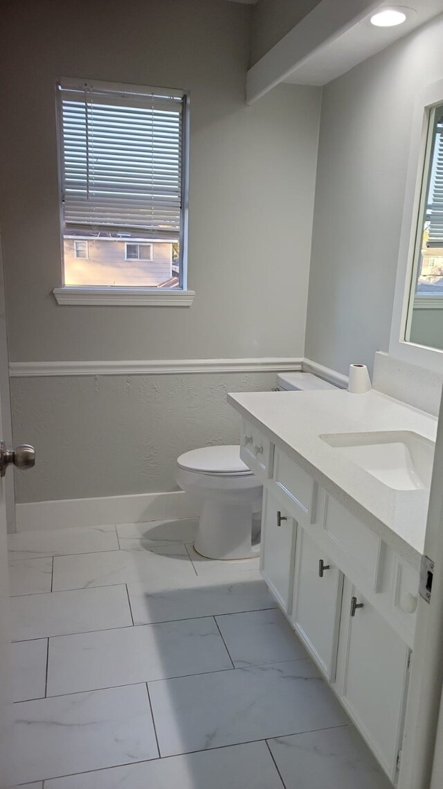 5703 Green Timbers Dr, Humble, TX 77346 - half bath featuring marble look tiles and vanity