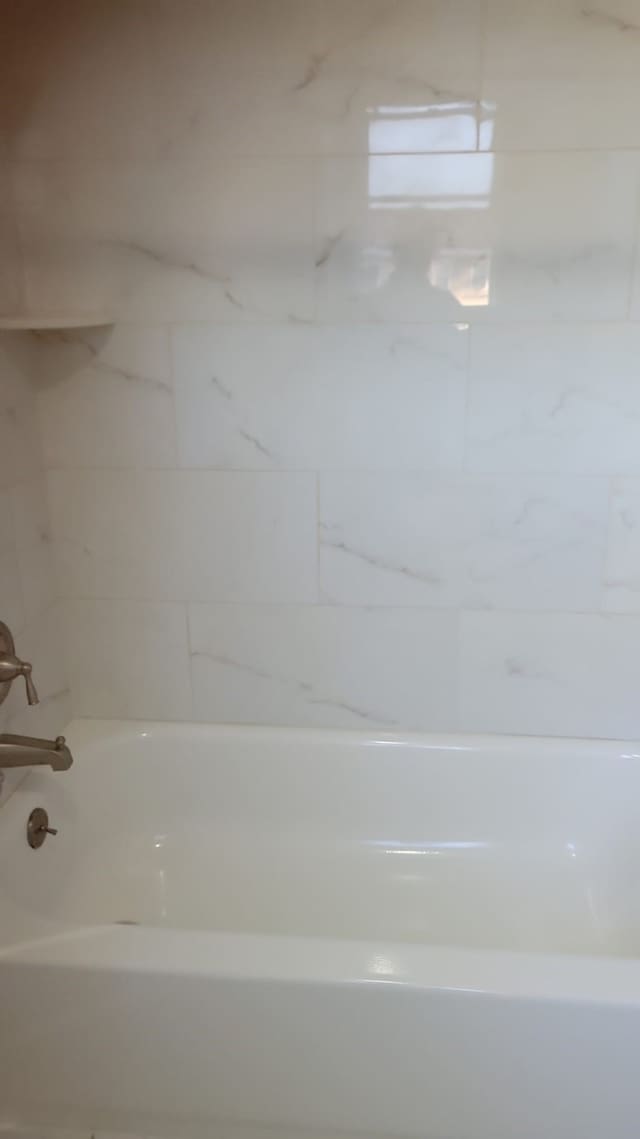 5703 Green Timbers Dr, Humble, TX 77346 - bathroom featuring tub / shower combination
