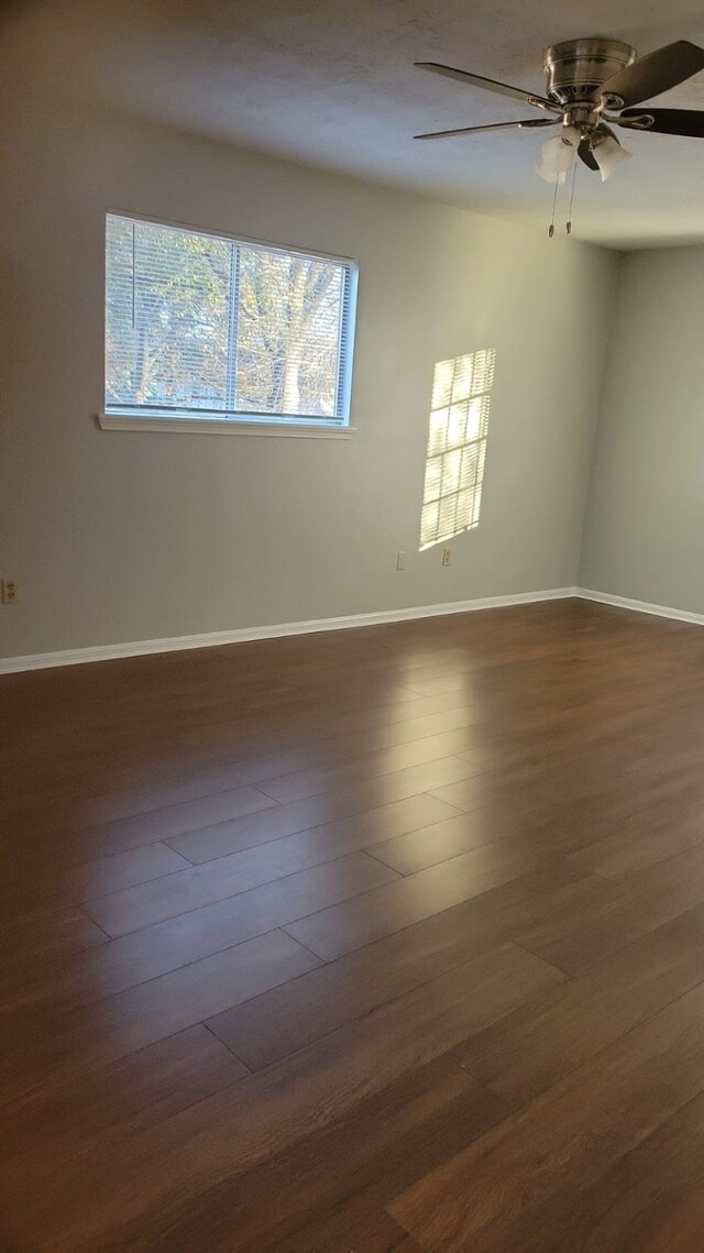 5703 Green Timbers Dr, Humble, TX 77346 - unfurnished room with dark wood-style floors and a ceiling fan