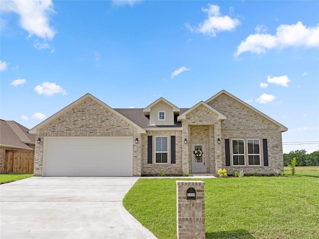 1200 Sailfish Dr, Bay City, TX 77414 - view of front of house with driveway, an attached garage, and brick siding