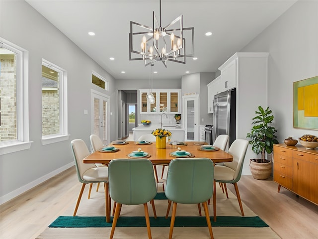 1200 Sailfish Dr, Bay City, TX 77414 - dining room featuring light wood-style floors, a chandelier, and recessed lighting
