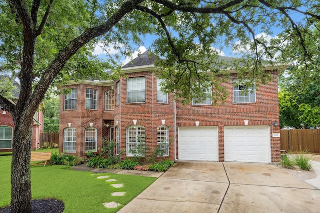 7938 S Wellington Ct, Houston, TX 77055 - view of front of property featuring brick siding, concrete driveway, and a garage