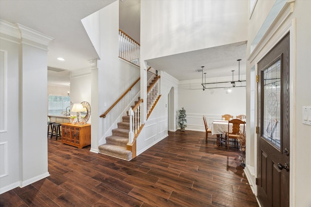 7938 S Wellington Ct, Houston, TX 77055 - foyer entrance with wood finished floors, crown molding, and stairway