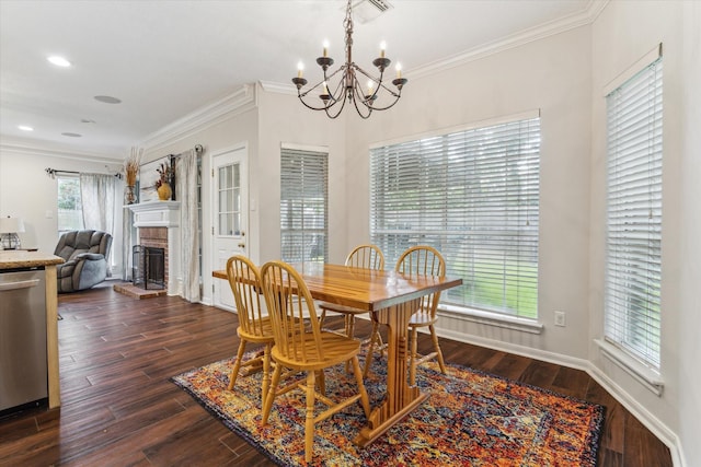 7938 S Wellington Ct, Houston, TX 77055 - dining area with a chandelier, crown molding, a fireplace, dark wood-style floors, and recessed lighting
