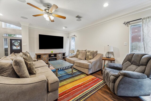 7938 S Wellington Ct, Houston, TX 77055 - living area with dark wood finished floors, healthy amount of natural light, ornamental molding, ceiling fan, and recessed lighting