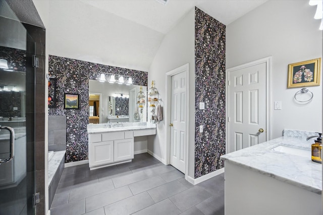 7938 S Wellington Ct, Houston, TX 77055 - full bath featuring vaulted ceiling, vanity, a stall shower, and tile patterned floors