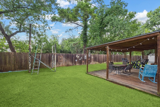 7938 S Wellington Ct, Houston, TX 77055 - fenced backyard with outdoor dining space and a deck