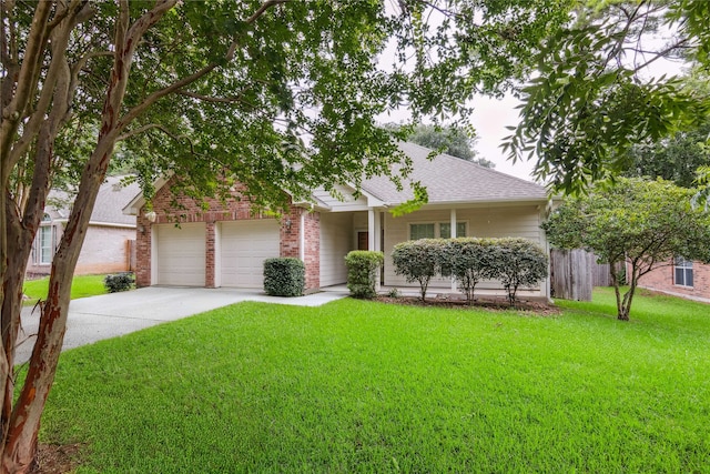 3418 Nottingham Ln, Montgomery, TX 77356 - view of front facade with concrete driveway, a front yard, roof with shingles, brick siding, and an attached garage