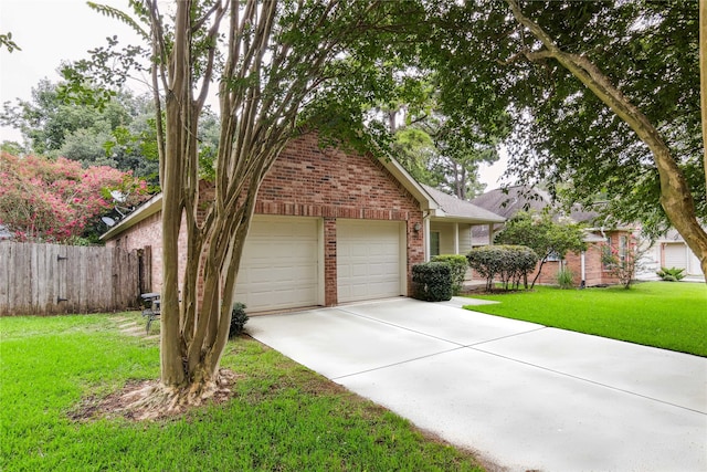 3418 Nottingham Ln, Montgomery, TX 77356 - view of front of house featuring brick siding, concrete driveway, and an attached garage