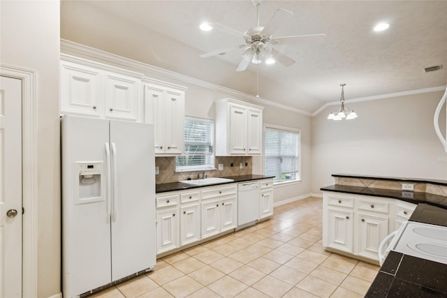 3418 Nottingham Ln, Montgomery, TX 77356 - kitchen with white appliances, dark countertops, tasteful backsplash, ceiling fan, and lofted ceiling