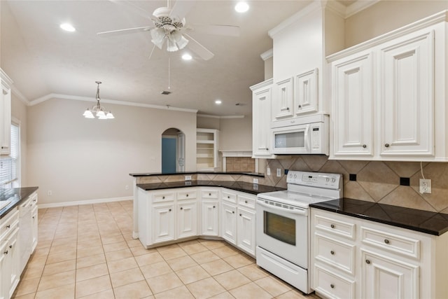 3418 Nottingham Ln, Montgomery, TX 77356 - kitchen featuring white appliances, dark countertops, a peninsula, arched walkways, and ceiling fan