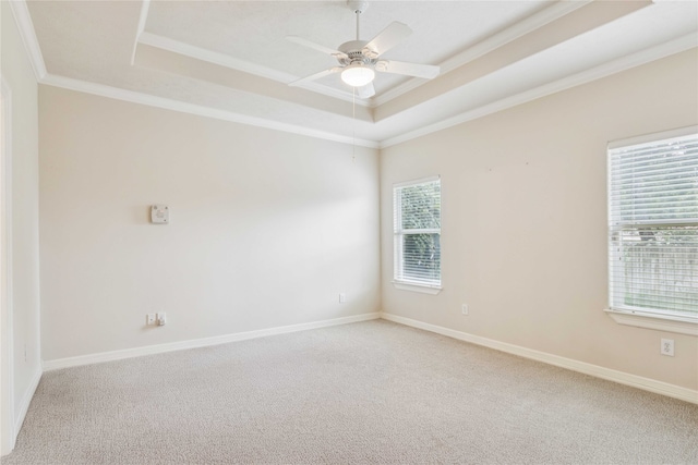 3418 Nottingham Ln, Montgomery, TX 77356 - empty room with a tray ceiling, crown molding, light colored carpet, and a ceiling fan
