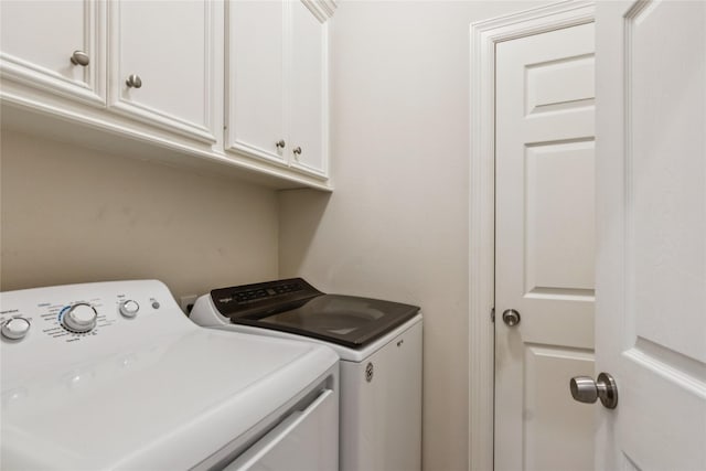 3418 Nottingham Ln, Montgomery, TX 77356 - laundry room with washer and dryer and cabinet space