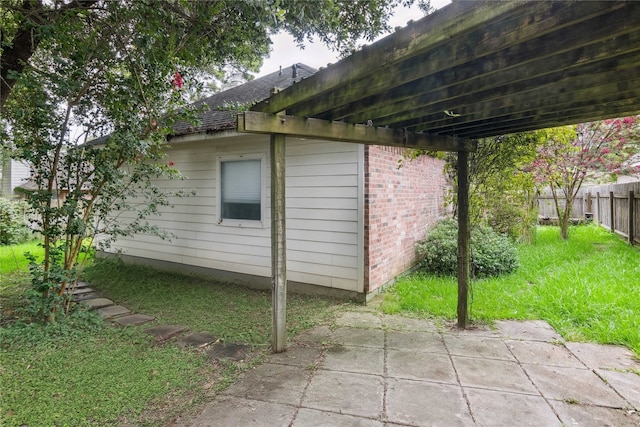 3418 Nottingham Ln, Montgomery, TX 77356 - view of home's exterior with brick siding and a patio