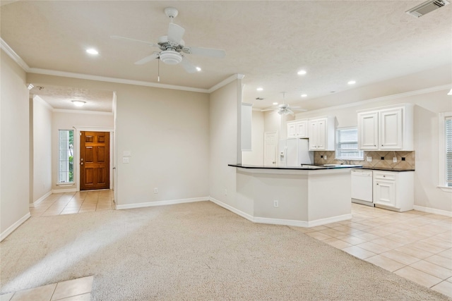 3418 Nottingham Ln, Montgomery, TX 77356 - kitchen with white appliances, a ceiling fan, light tile patterned floors, dark countertops, and recessed lighting