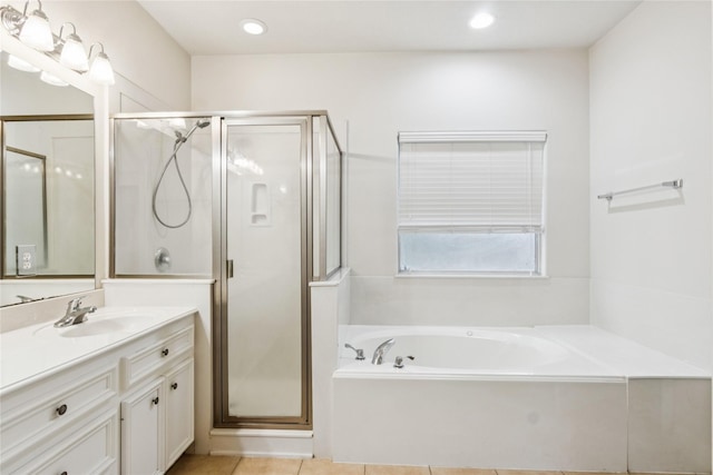 3418 Nottingham Ln, Montgomery, TX 77356 - full bathroom featuring vanity, a shower stall, a bath, recessed lighting, and tile patterned floors