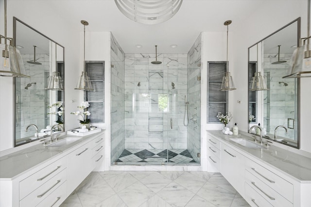 1220 Bomar St, Houston, TX 77006 - bathroom with a stall shower, two vanities, and marble finish floors