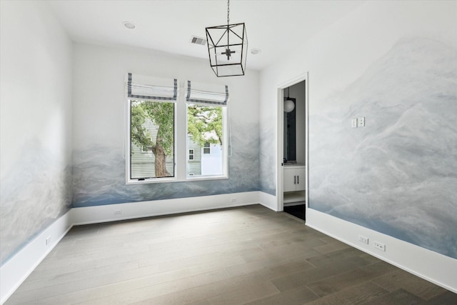 1220 Bomar St, Houston, TX 77006 - spare room featuring dark wood-style floors and a chandelier