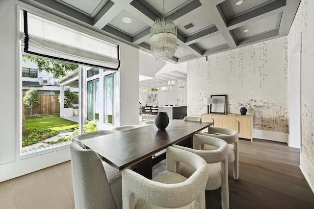 1220 Bomar St, Houston, TX 77006 - dining space with a chandelier, coffered ceiling, beamed ceiling, wood finished floors, and recessed lighting