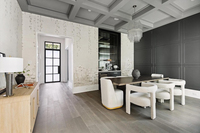 1220 Bomar St, Houston, TX 77006 - dining room featuring a chandelier, coffered ceiling, wood finished floors, and beamed ceiling