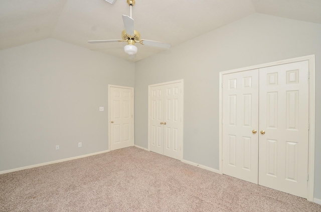 4415 Crimson Ct, Sugar Land, TX 77479 - unfurnished bedroom with lofted ceiling, carpet floors, multiple closets, and ceiling fan